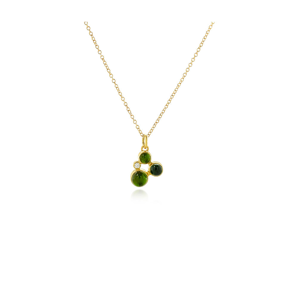 Three blue/green tourmalines, approximately 1.75 cttw, and a round diamond, .025 cts, in a "confetti" cluster with 18k yellow gold and 14k yellow gold behind stones. Pendant is on a 18'' long, 18k yellow gold chain and ranges from 5/8" -3/4" x 3/8" (16-19 x 10 mm) in size.