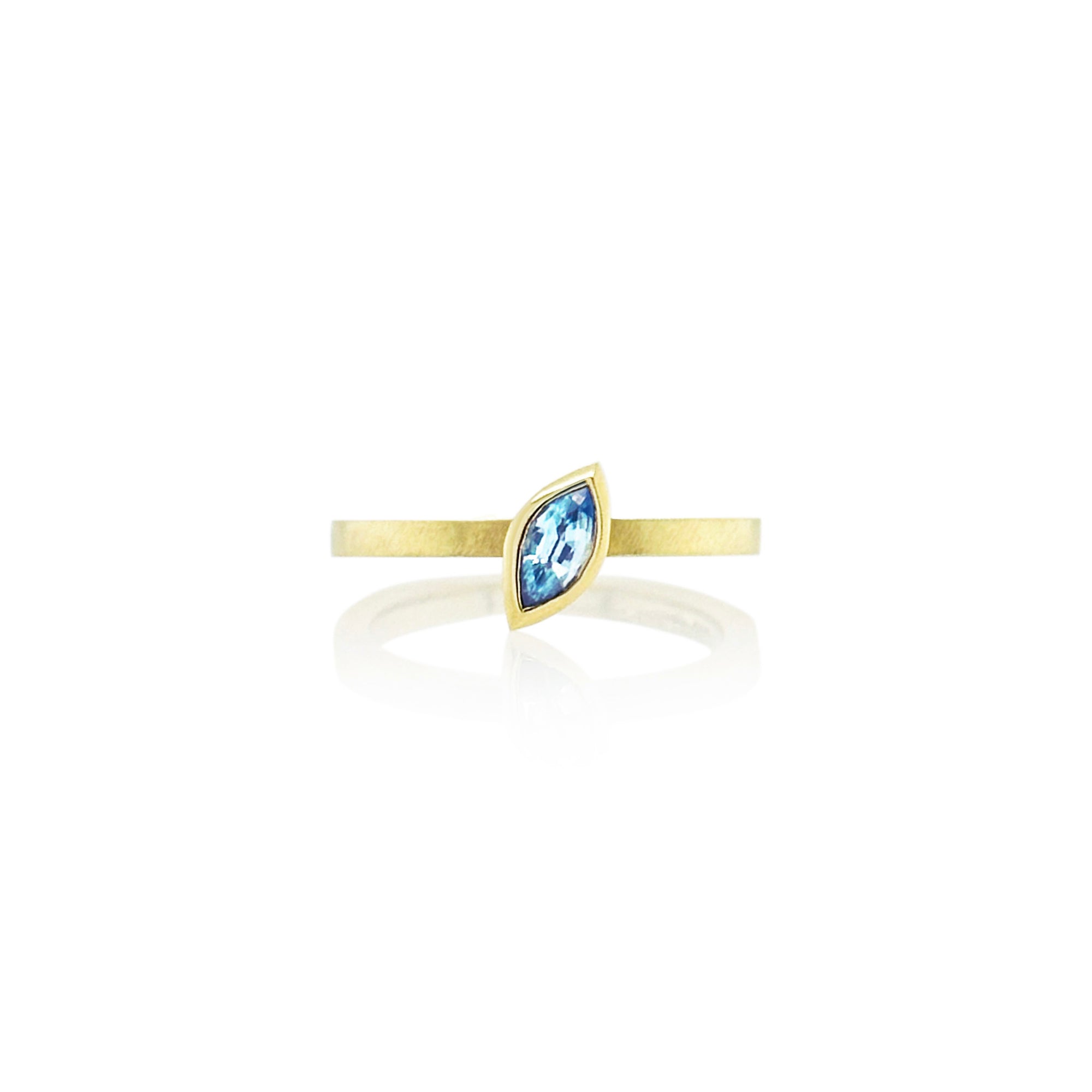 Marquise-shaped blue zircon ring, 6 x 3 mm, set in 14k yellow gold. Ring is a size 6.