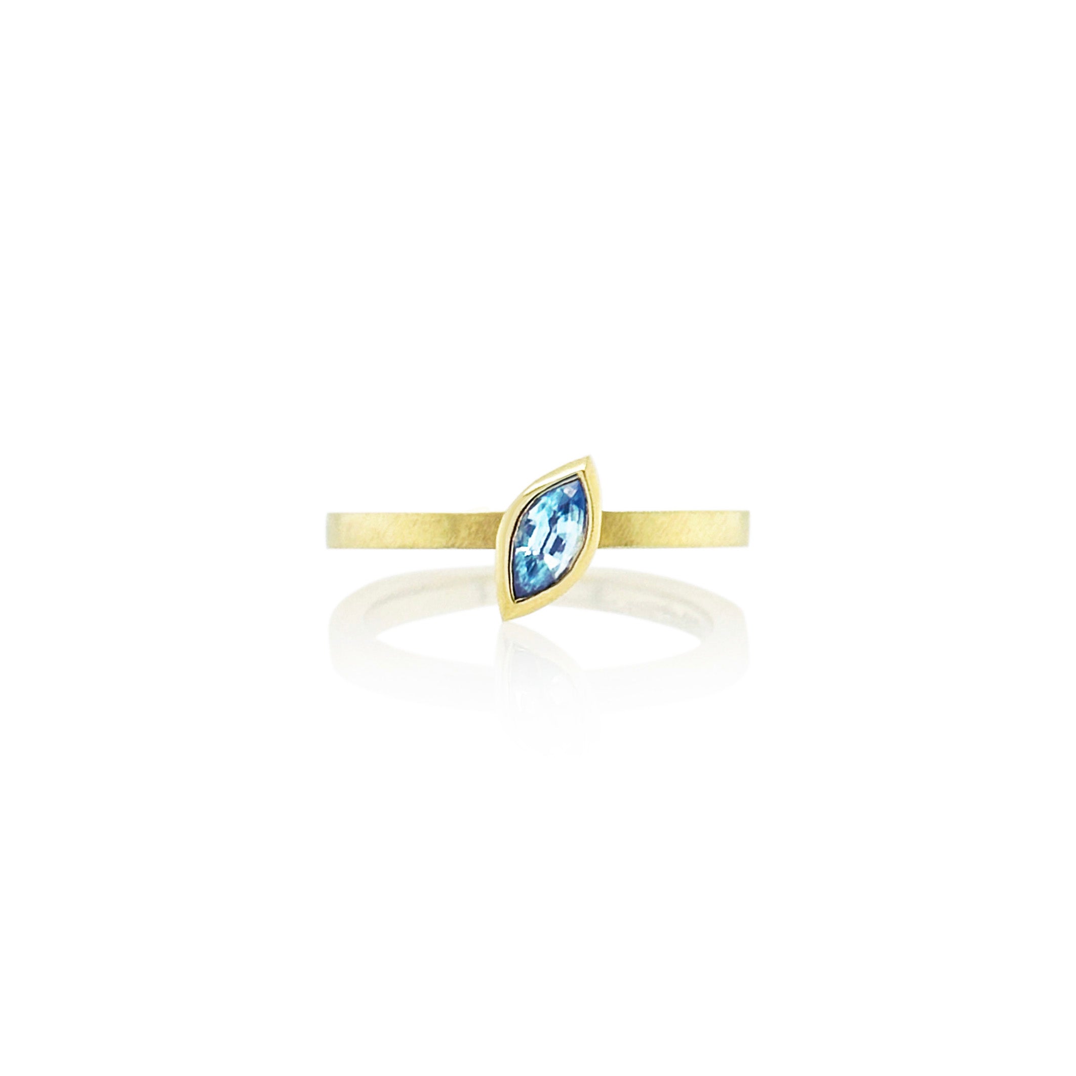 Marquise-shaped blue zircon ring, 6 x 3 mm, set in 14k yellow gold. Ring is a size 6.