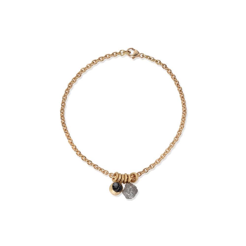 18k yellow gold bracelet with rough diamond sphere,5.2mm, 2.50cts, and rose-cut black diamond, 7mm, 1.31 cts, on a 18cm chain with a lobster clasp.