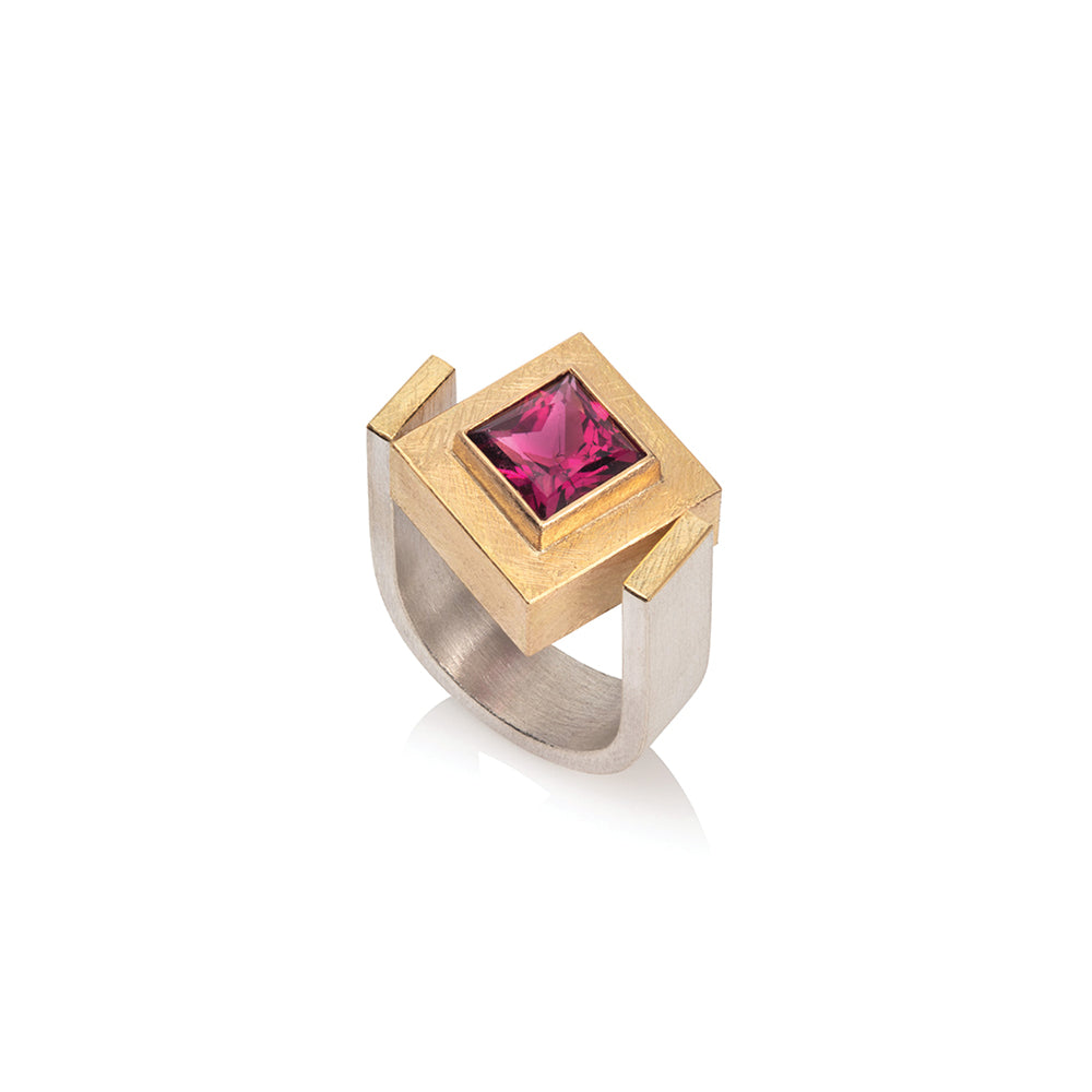 22k gold and sterling silver ring with an offset square rubellite tourmaline, 2.70 cts, in a U-shaped ring shank. Ring is a size 7.75 and rubellite is 8x8mm.