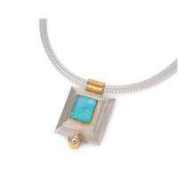24k yellow gold and sterling silver step bezel pendant with rectangular Australian Bolder opal, 3.33 cts, and a round diamond, 0.24ct. Pendant is on a woven sterling silver chain.