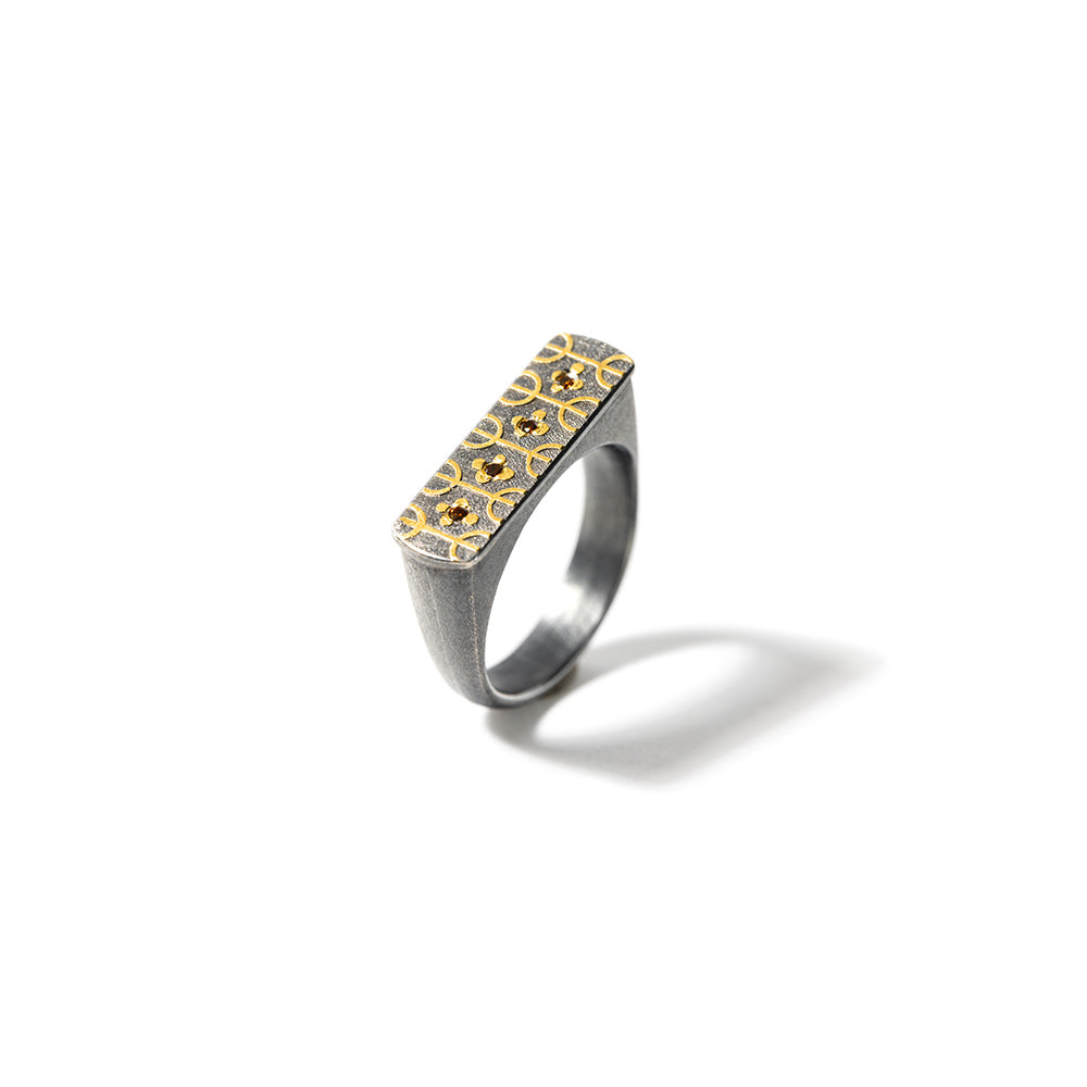 Tribal ring #1 in oxidized sterling silver, 24K yellow gold, red-brown diamonds, 0.04cttw, ring size 6.5. Ring is 1/4" W (6mm). Symbols on the ring face mean "Free People".