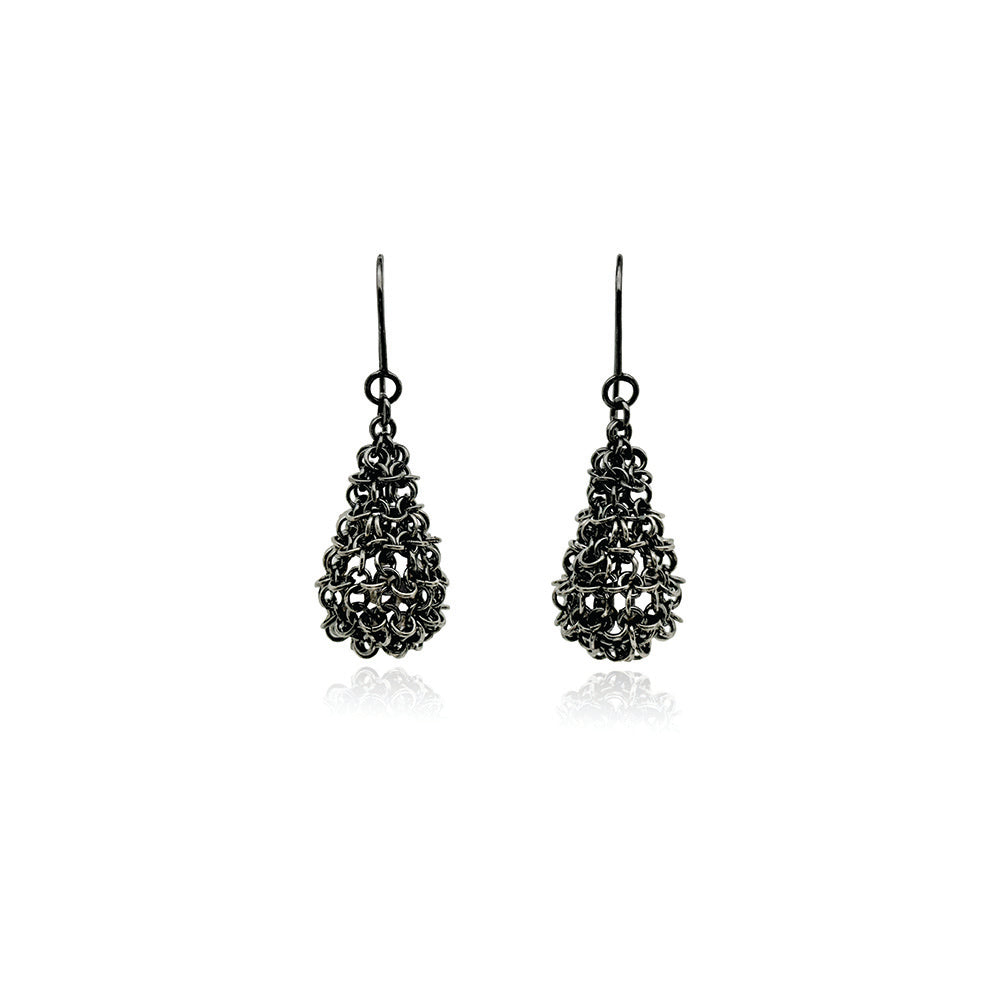 Oxidized sterling silver chainmaille pods with an enclosed pearl. Earrings are on French wires and are 1 7/8" long x 5/8" wide (48 x 16 mm). 