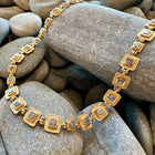 hinged necklace with square grey diamonds