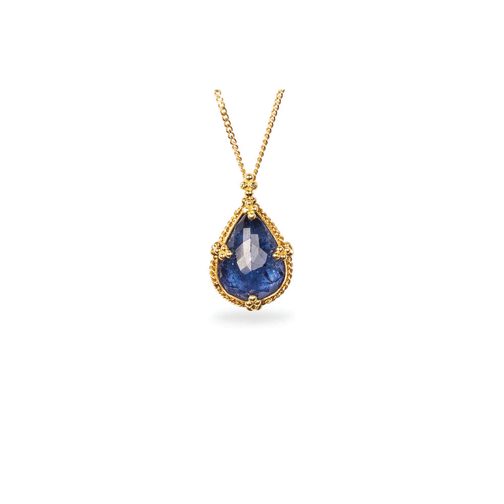 One-of-a-kind pendant with a tear drop-shaped Tanzanite,5.57cts, set in 18k yellow gold with granulation on bail. Pendant is 3/4" long x 1/2" wide (19mm x 12mm) on and adjustable 18k chain (16"-18").