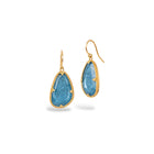 One-of-a-kind earrings with large irregular teardrop-shaped aquamarine, 11.08cts, set in 18k yellow gold granulated bezels on 18k yellow gold French wires. Earrings are 1 1/4" long x 9/16" wide (32 x 14mm).
