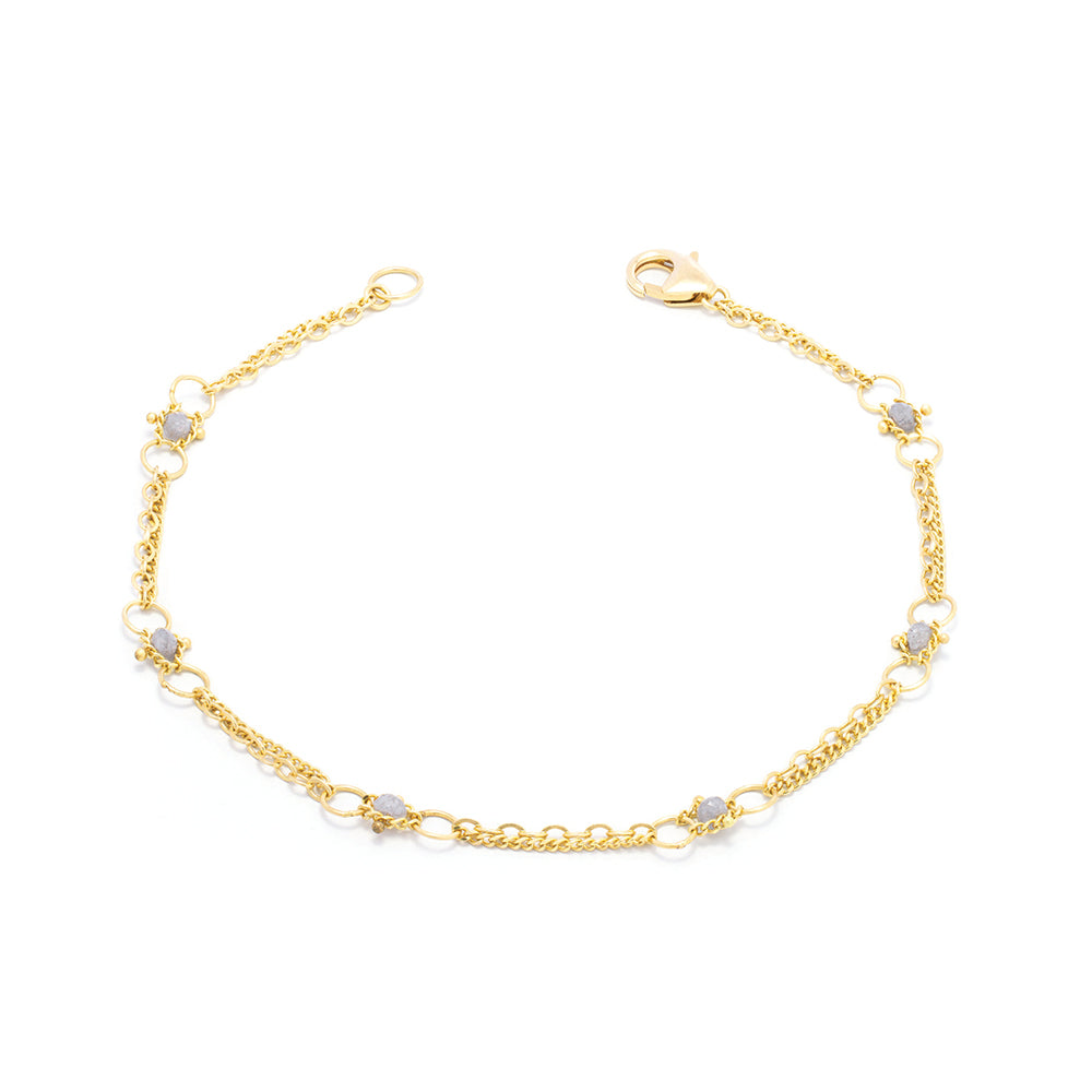 "Whisper Chain" silver diamond bracelet with approximately .60 cttw, in 18k yellow gold with a lobster clasp. Bracelet is 7" long x 3/16" wide (4mm).