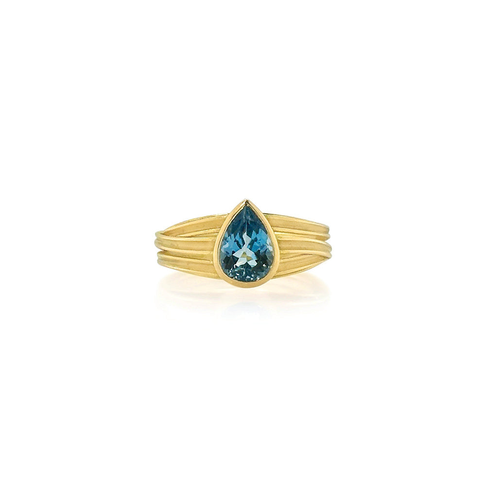 Pear-shaped aquamarine ring, 1.34 cts, on a 18k yellow gold double tier three ribbon band. Ring is a size 6.75.
