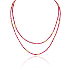 34" long multi-wrap ruby, 6.94 cttw, and red spinel, 25.48 cttw, beaded bracelet with gold beads. Bracelet has a lobster clasp and a 2" extension.