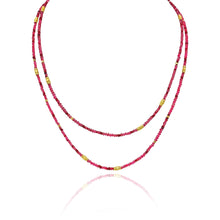34" long multi-wrap ruby, 6.94 cttw, and red spinel, 25.48 cttw, beaded bracelet with gold beads. Bracelet has a lobster clasp and a 2" extension.