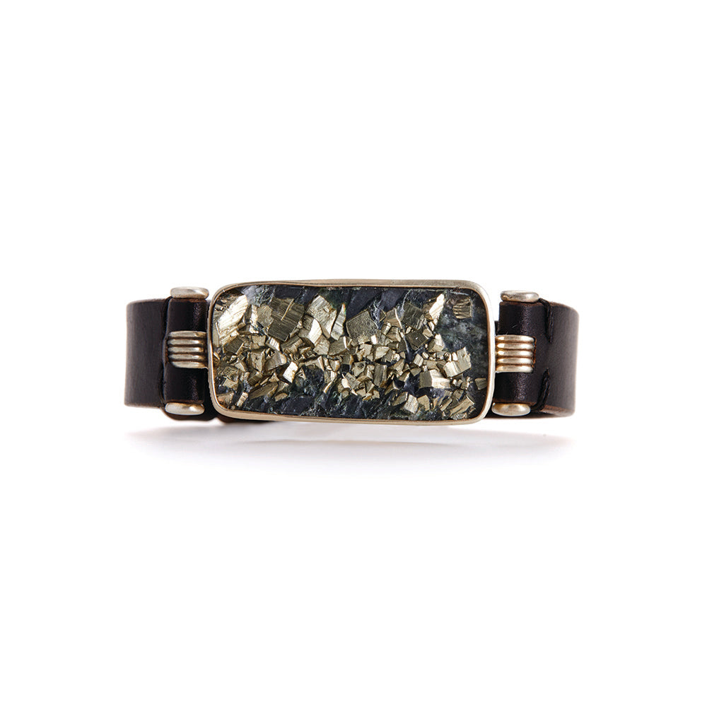 Pyrite in slate, set in 18k warm white gold, silver and steel in a leather band. Bracelet is 3/4" wide.