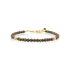 Chocolate diamond faceted bead bracelet, approximately 20 cttw, with 18k yellow gold owl spacer beads with VS White diamonds. Bracelet is 7" long with a 1 3/4" extension chain and lobster clasp. Diamonds are graduated 4mm-4.5mm.