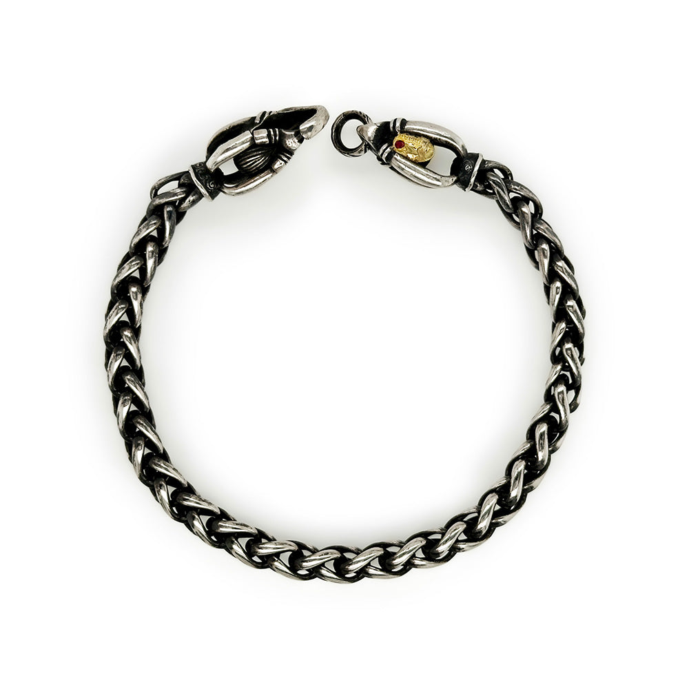 Oxidized sterling silver wheat chain; 6mm and custom made locking links; 18k gold and one ruby on hallmark. Bracelet is 9" long x 1/4" wide.