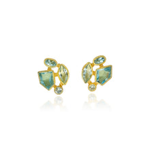 Faceted aquamarine stud-back earrings in mixed cuts and shapes, 4 cttw. Earrings are set in 22k gold bezels with 18k backings and spacers.