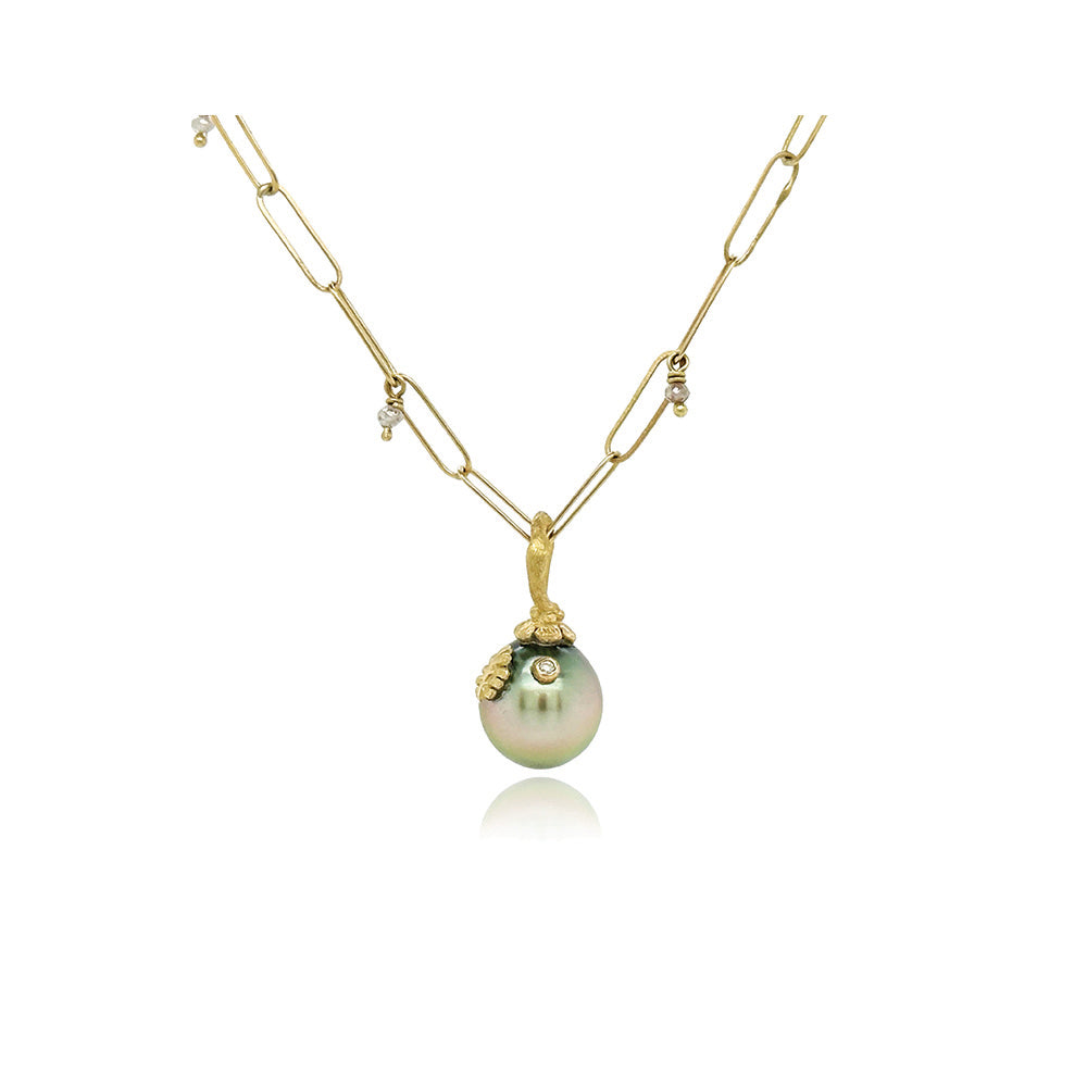 Blue-grey Tahitian pearl pendant with hand-fabricated 18k gold flower bail, oak leaf and white diamond, 0.01ct. Pendant is 7/8"L x 7/16" diameter. ***CHAIN SOLD SEPARATELY***
