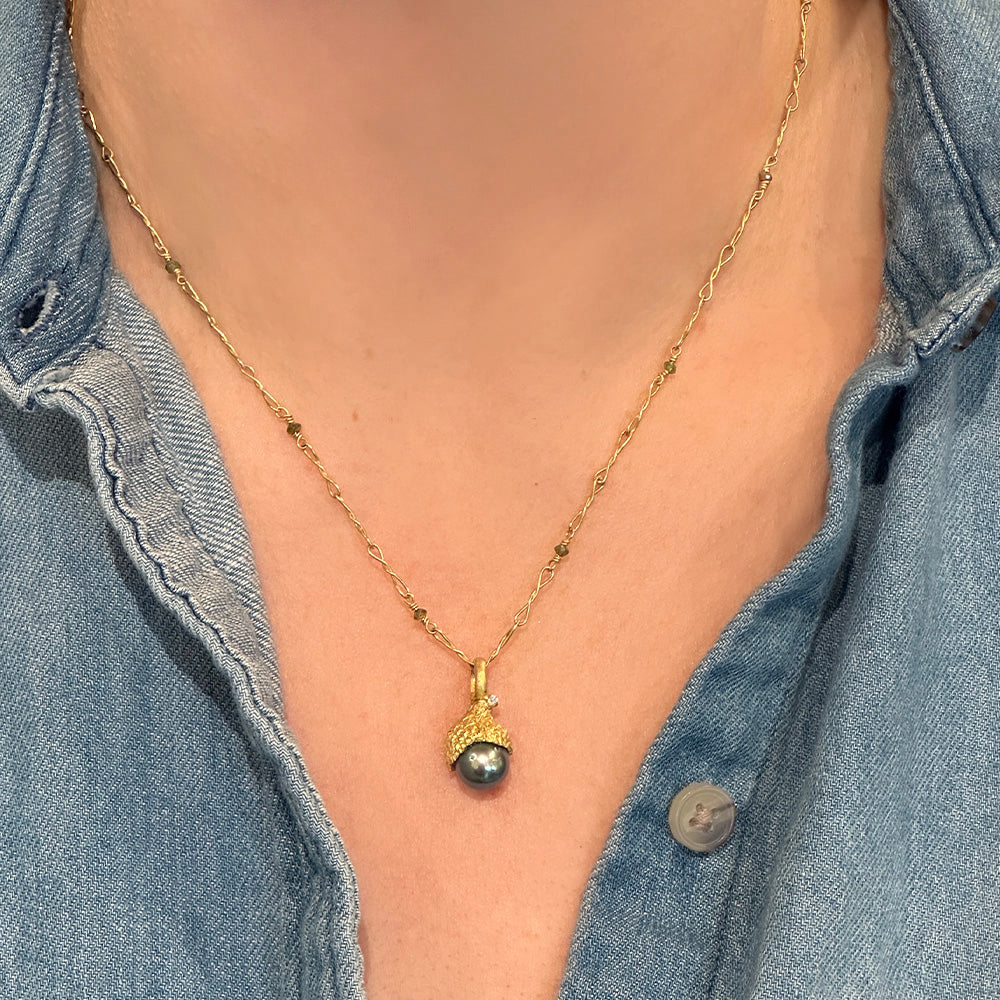 Grey Tahitian pearl pendant with hand-fabricated acorn top and bail with white diamond, 0.01ct. Pendant is 7/8" L x 3/8" diameter. ***CHAIN SOLD SEPARATELY***