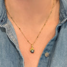 Grey Tahitian pearl pendant with hand-fabricated acorn top and bail with white diamond, 0.01ct. Pendant is 7/8" L x 3/8" diameter. ***CHAIN SOLD SEPARATELY***