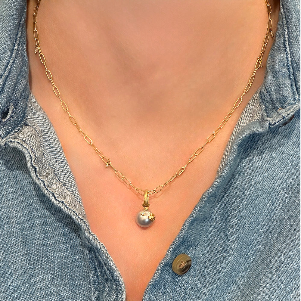 Akoya pearl pendant with hand-fabricated flower and bail and white diamond, 0.01ct. Pendant is 3/4" L x 3/8" diameter. ***CHAIN SOLD SEPARATELY***