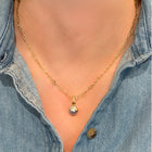 Akoya pearl pendant with hand-fabricated flower and bail and white diamond, 0.01ct. Pendant is 3/4" L x 3/8" diameter. ***CHAIN SOLD SEPARATELY***