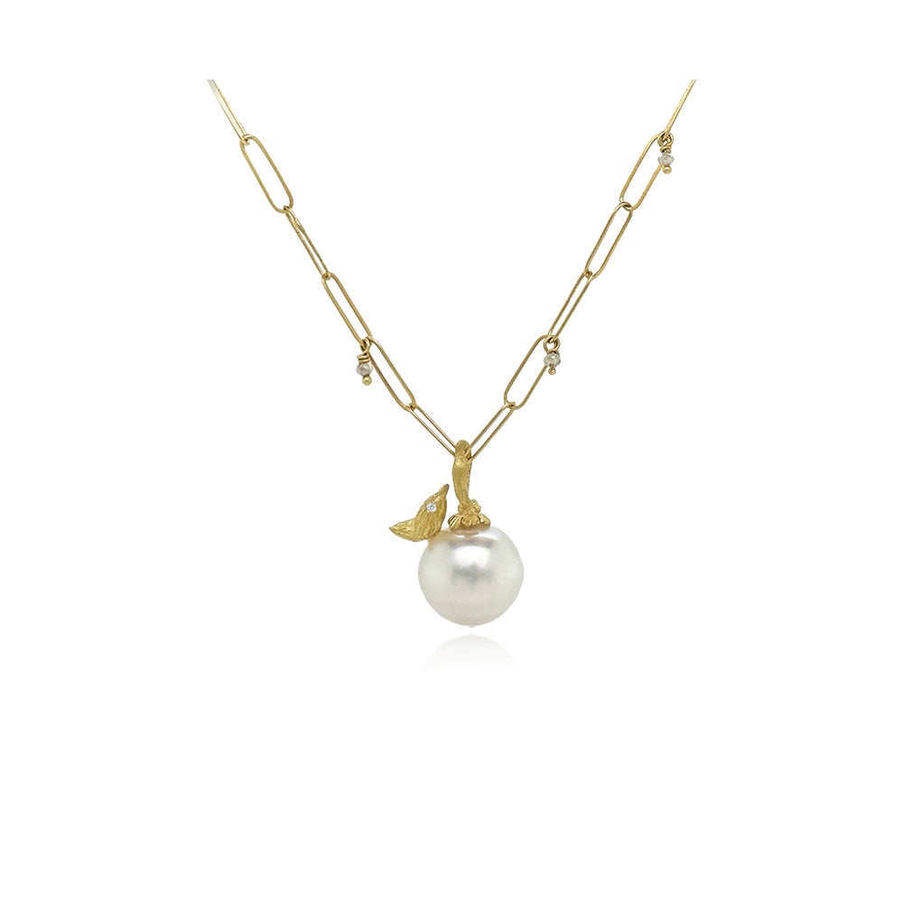 South Seas white pearl pendant in 18k yellow gold with hand-fabricated bird, white diamond, 0.01ct and flower bail. Pendant is 1" L x 1/2" diameter. ***CHAIN SOLD SEPARATELY***