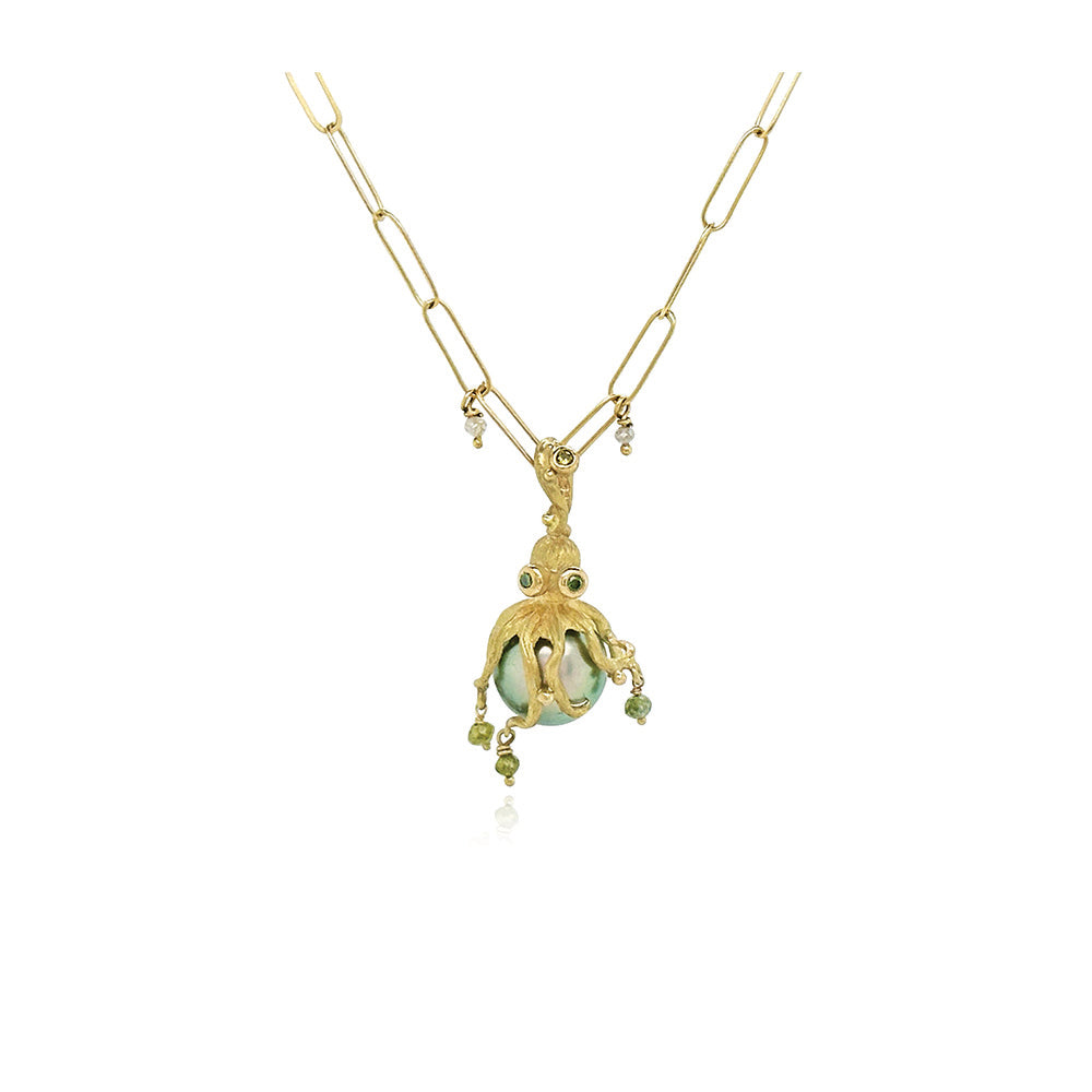 18k yellow gold, hand-fabricated octopus pendant with green diamonds, 0.09cttw and green diamond beads on a blue-grey Tahitian pearl. Pendant is 1 1/4" L x 5/8" diameter (32 x 16mm). ***CHAIN SOLD SEPARATELY***