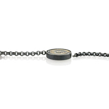 Round Vario clasp in oxidized sterling silver and 12k white gold, with white (G) diamonds, vsi, 0.18 cttw. Clasp is 27mm (1 1/8") diameter and 6mm high.