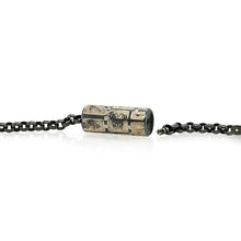 Vario spring style clasp with oxidized sterling silver, 12k yellow gold, and white (G) diamonds vsi, 0.23 cttw. Clasp is to be used with Vario style chains or strands, and is 1.1" long with a diameter of 0.4".