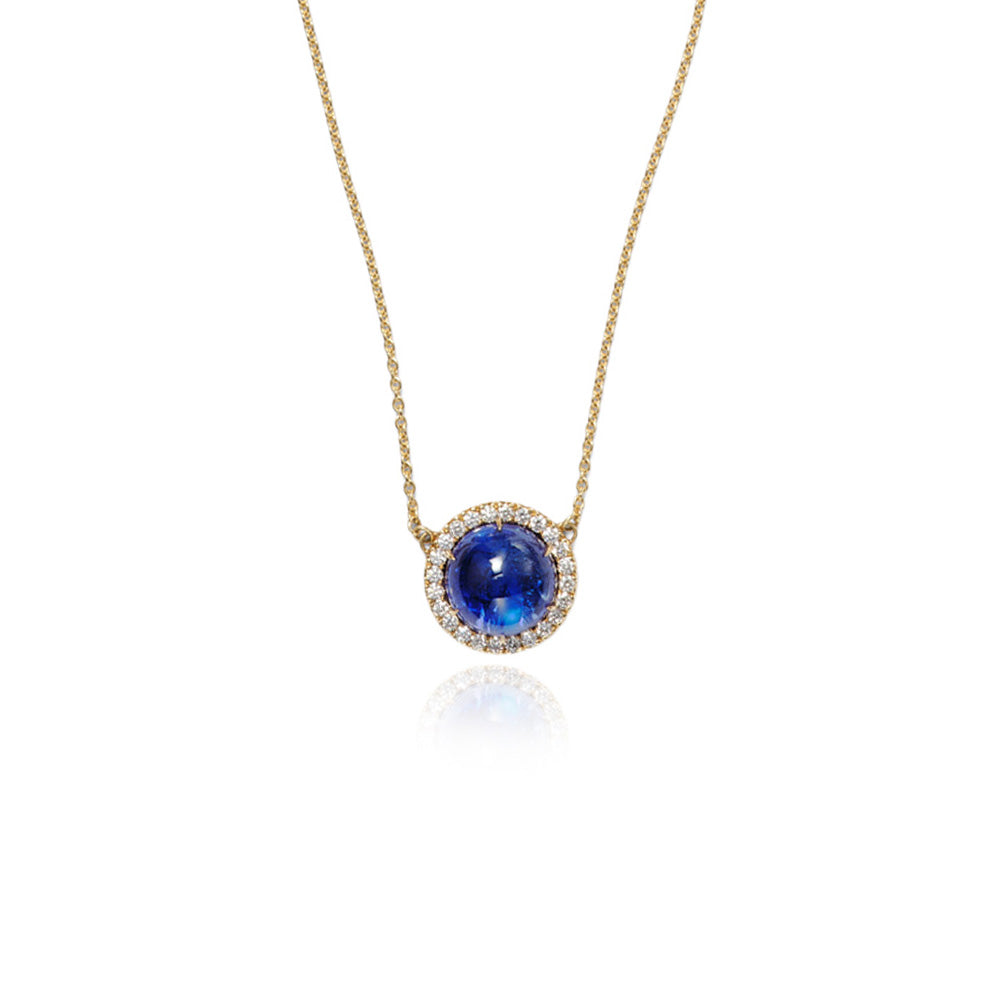 Luna Tanzanite round cabochon pendant surrounded by pavé-set diamonds, 0.72 cttw, on 18k yellow gold chain. Tanzanite is 14mm.