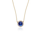 Luna Tanzanite round cabochon pendant surrounded by pavé-set diamonds, 0.72 cttw, on 18k yellow gold chain. Tanzanite is 14mm.
