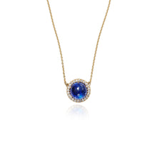 Luna Tanzanite round cabochon pendant surrounded by pavé-set diamonds, 0.72 cttw, on 18k yellow gold chain. Tanzanite is 14mm.