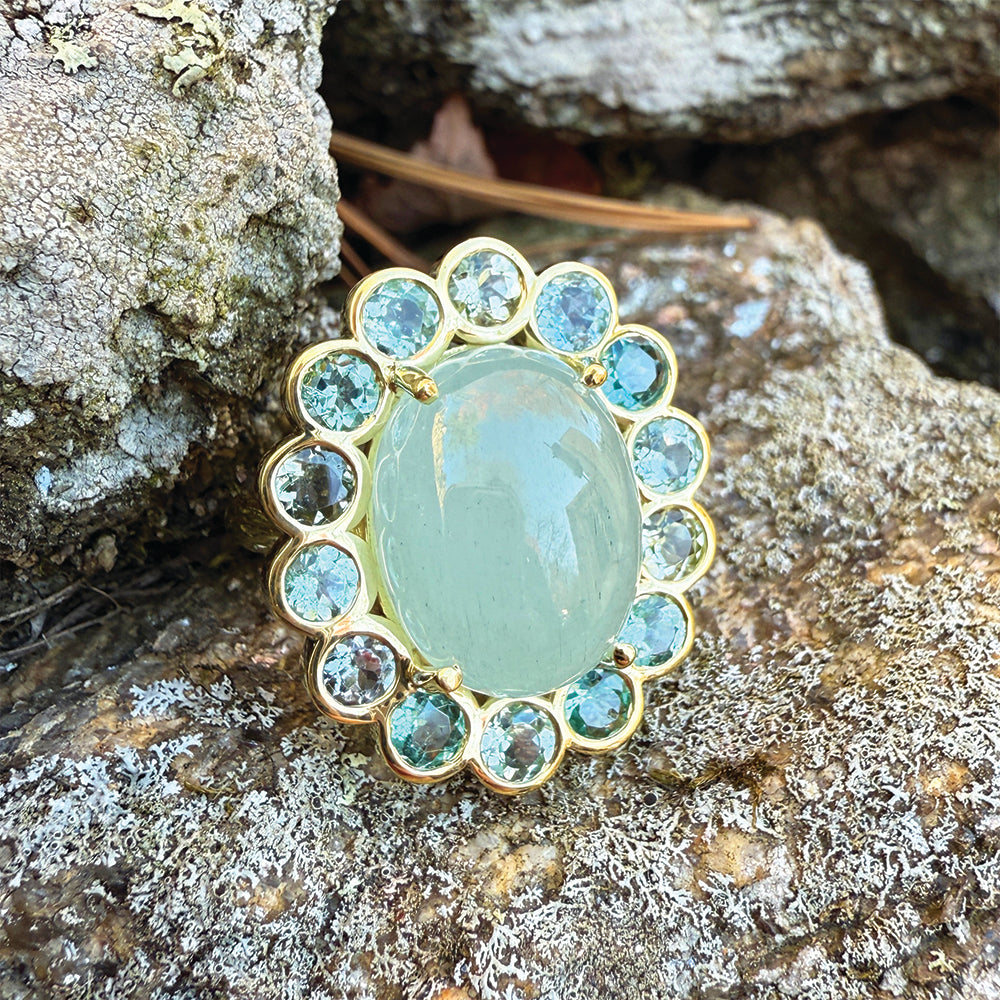 Blossom ring with Aqua and tourmaline surround