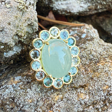 Blossom ring with Aqua and tourmaline surround