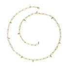 18k gold popsicle stick necklace with hanging diamond beads and a lobster clasp. Necklace is 22.5" long.