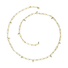 18k gold popsicle stick necklace with hanging diamond beads and a lobster clasp. Necklace is 22.5" long.