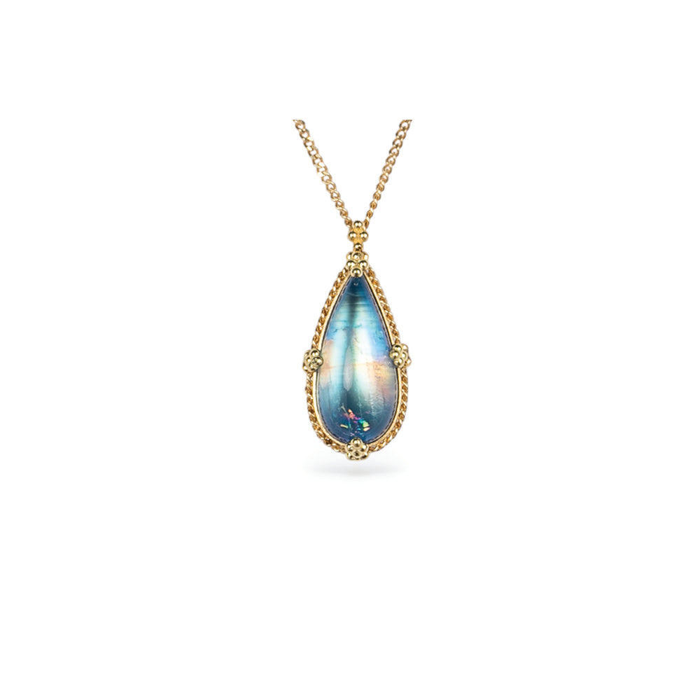 One-of-a-kind necklace with an elongated pear- shaped blue-flash moonstone with a rainbow feather inclusion, 6.48cts. Moonstone is 22mm long x 10mm wide with granulation on the bail and prongs. 18k adjustable chain (16"-18") with lobster clasp.