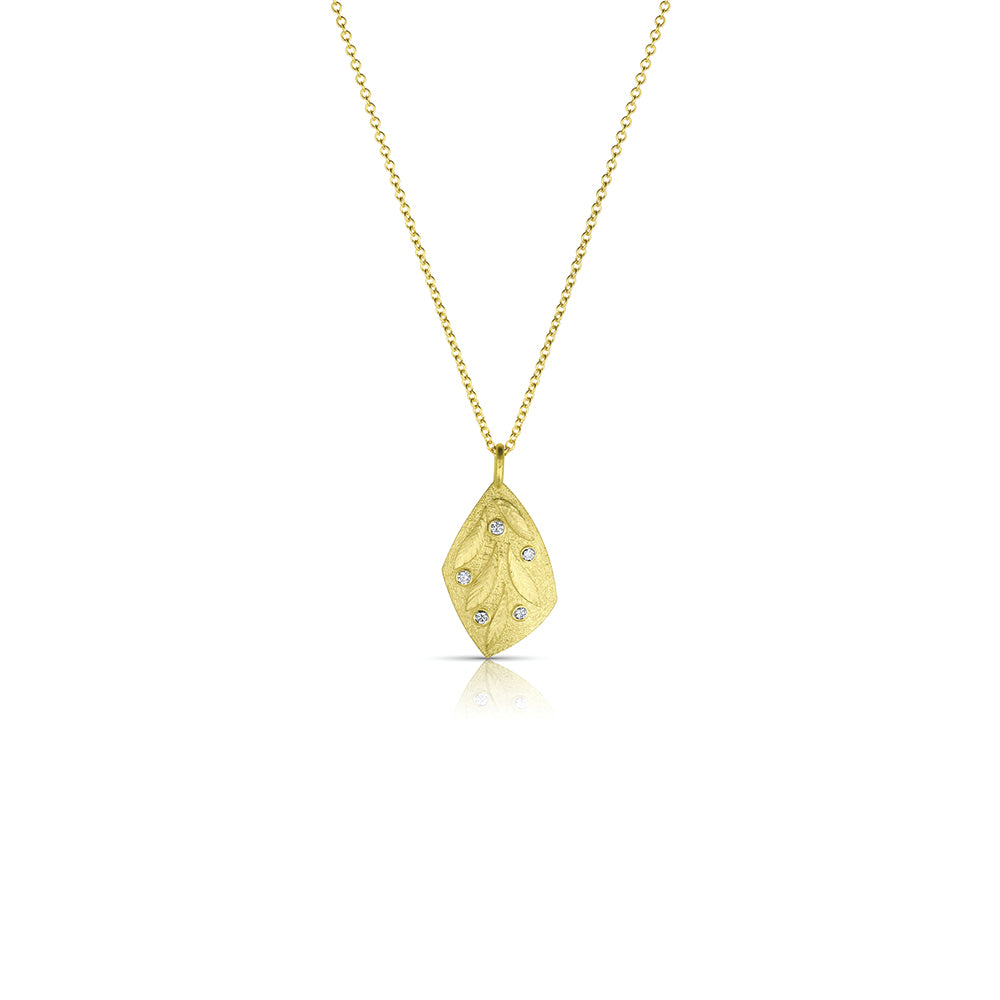 18k yellow gold kite-shaped pendant with engraved leaves and diamonds, .03cttw. Pendant is 20mm long x 11 mm wide. **Price is for pendant only**