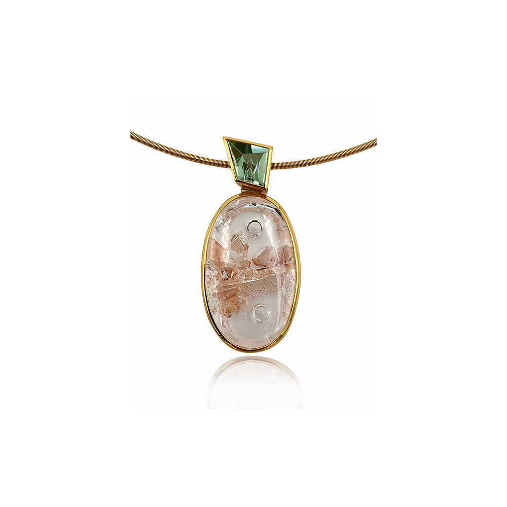 oval quartz pendant with quartz and iron inclusions with green tourmalinee