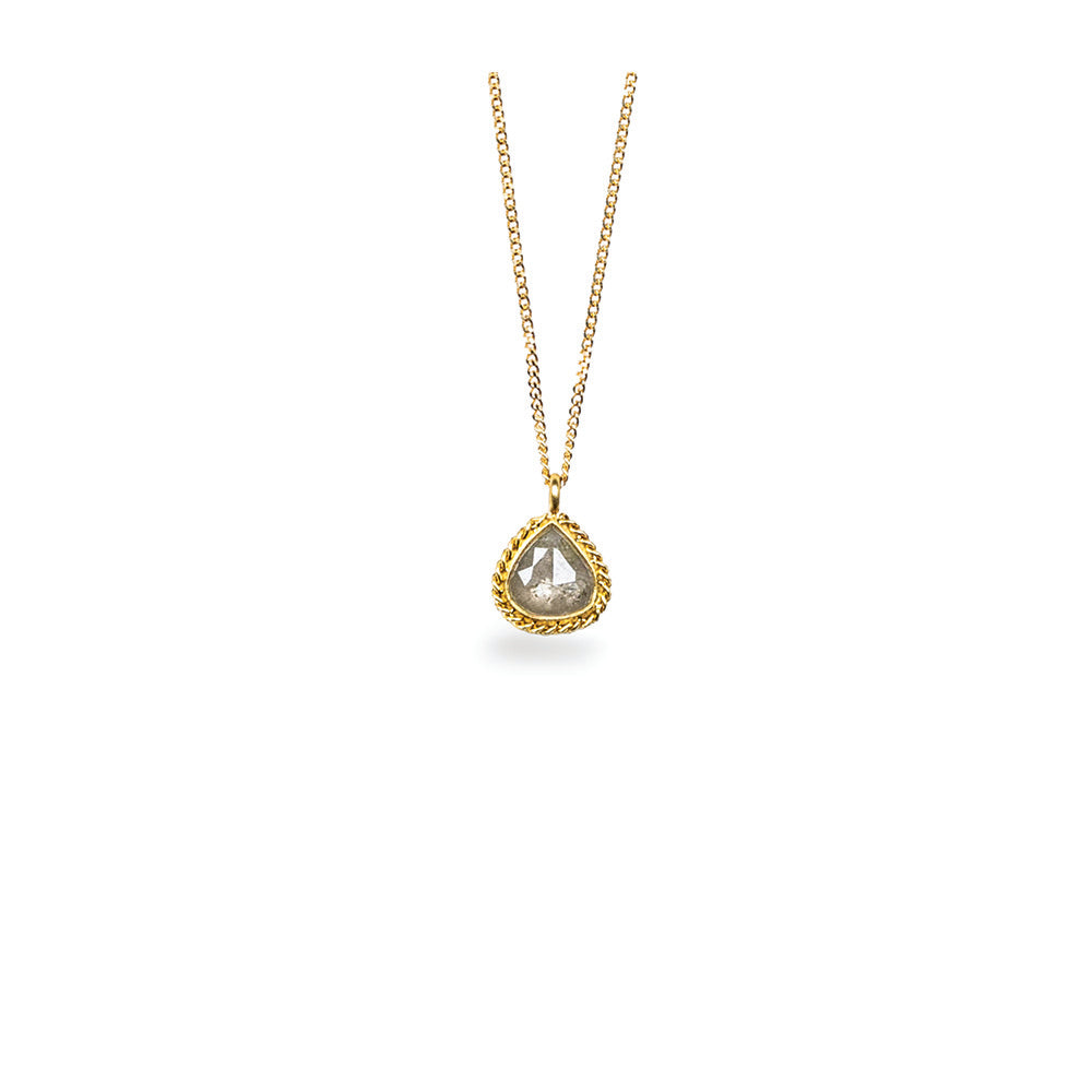 tear drop shaped silver diamond pendant with woven chain surround