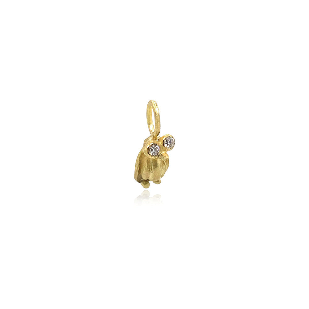 Hand-crafted 18k yellow gold penguin pendant with diamond eyes, 0.06cttw. Pendant is 17mm long. ***CHAIN SOLD SEPARATELY***