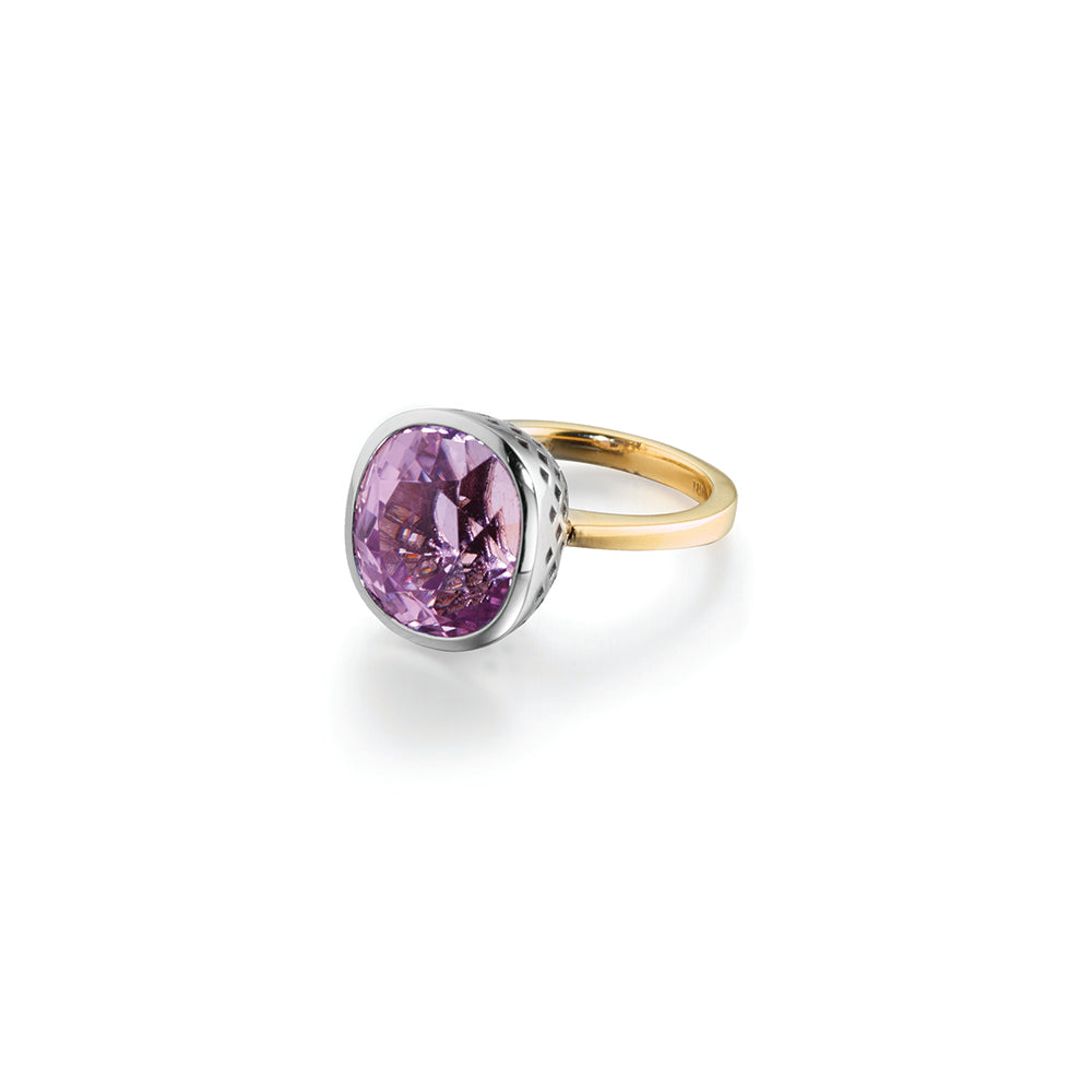 18k yellow gold cocktail ring with bezel set kunzite, 17.32 cts, in Palladium white gold crownwork setting. Ring is a size 7.5 and kunzite is 5/8"in diameter (16mm).
