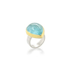 Tear-drop shaped cabochon aquamarine set in 22k yellow gold and a sterling silver ring shank. Aquamarine is 23 x 19mm and is a size 7.
