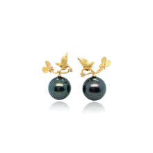 Hand-crafted 18k yellow gold birdie earrings with diamond eyes and accents, 0.06cttw, and a black Tahitian pearl, on posts. Earrings are 22mm wide x 24mm long. 