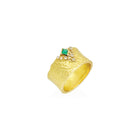 carved glacier ring with crevasse,diamonds and princess cut emerald