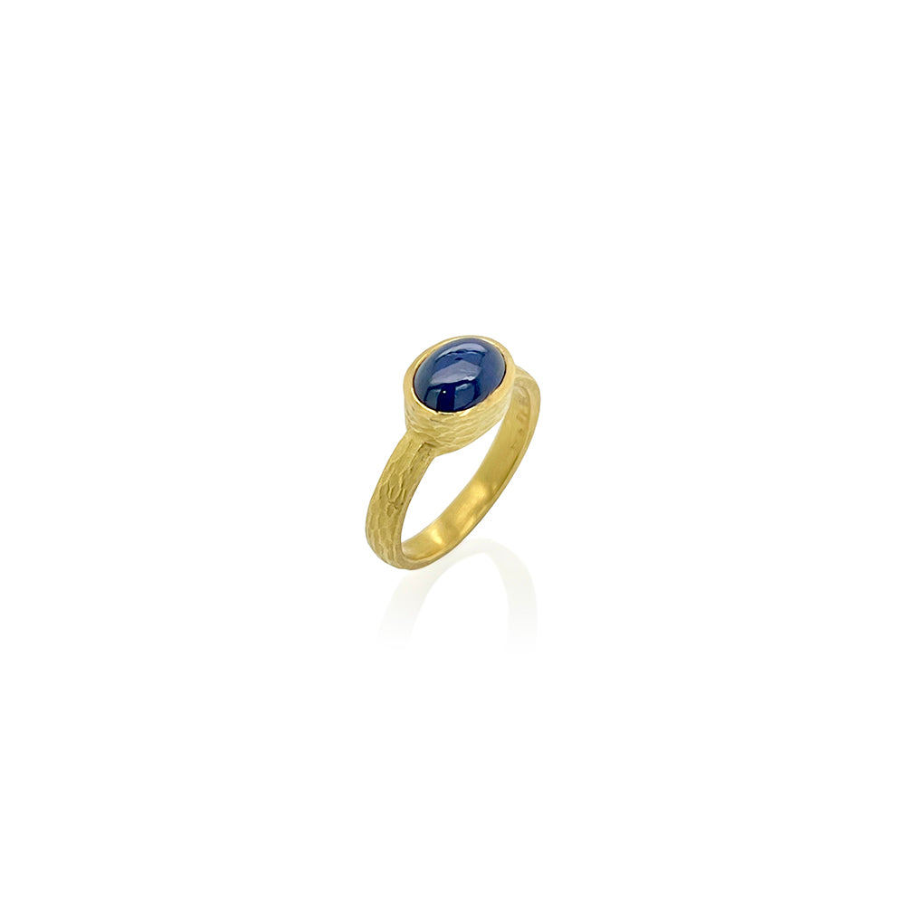 carved glacier band with oval sapphire cabochon