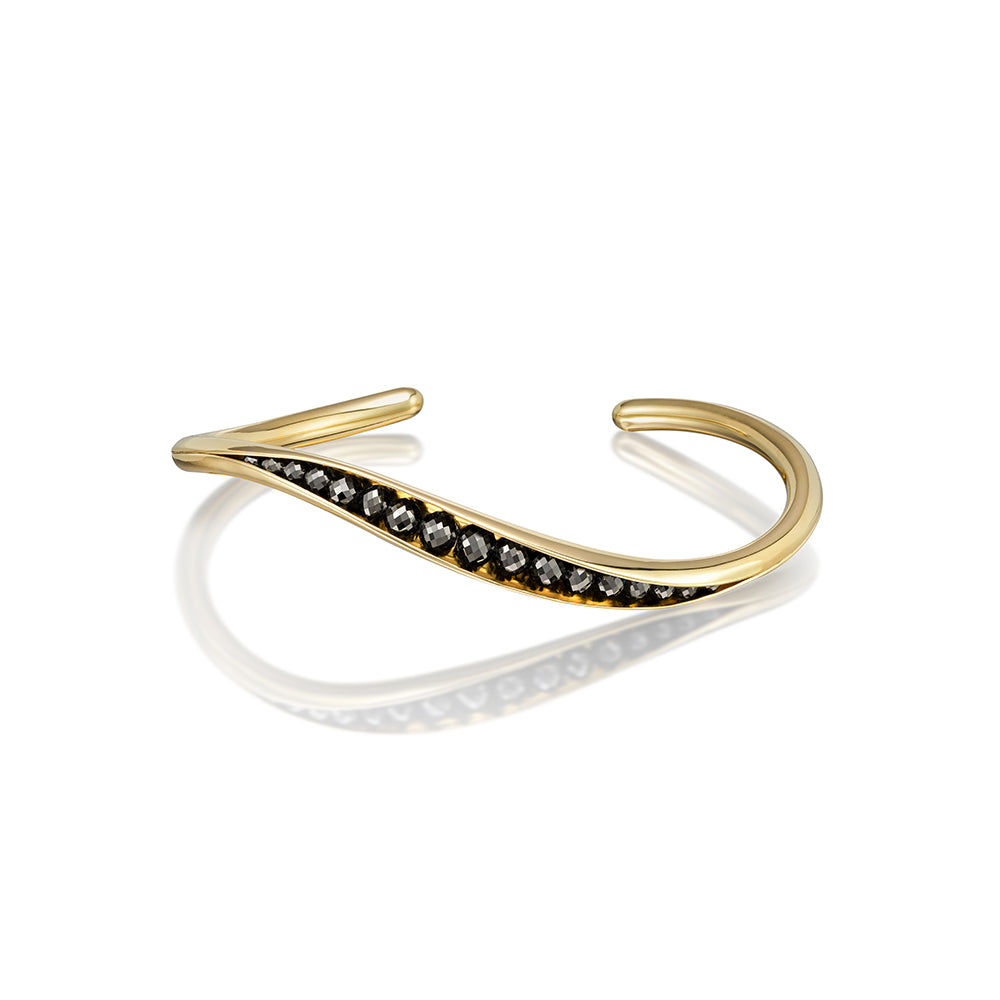 wave cuff bracelet with black diamonds in 18k yellow gold