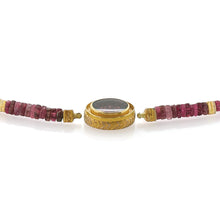 Rubellite tourmaline cut by Atelier Munsteiner, 9.30cts, set in 22k and 24k yellow gold, Vario clasp system, with vs white diamonds (G), 0.10cttw, pink diamonds, 0.03cttw, with trillion cut tourmaline strand, 20.5 grams, with 22k and 24k spacer beads. Strand works with the Vario Clasp system. Clasp is 7/8" L x 3/4" W x 5/16" H (22 x 20 x 7mm). Tourmaline strand has 9 spacer beads including end clasps and is 17" long. Total overall length with clasp is 17 7/8".