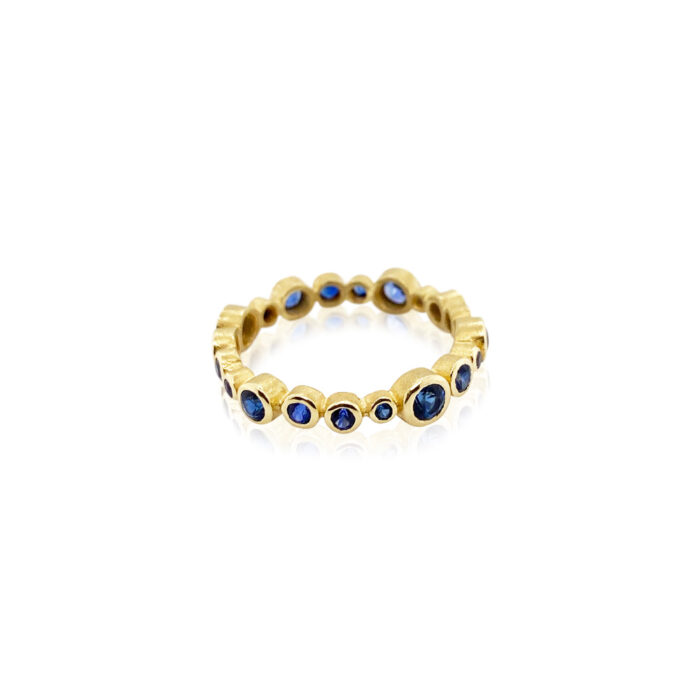 18k circle ring with multi-blue round sapphires