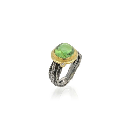 light green tourmaline ring with diamond accent