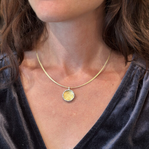Shield pendant in 18k with Platinum rim and diamonds